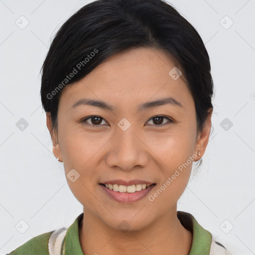 Joyful asian young-adult female with short  brown hair and brown eyes