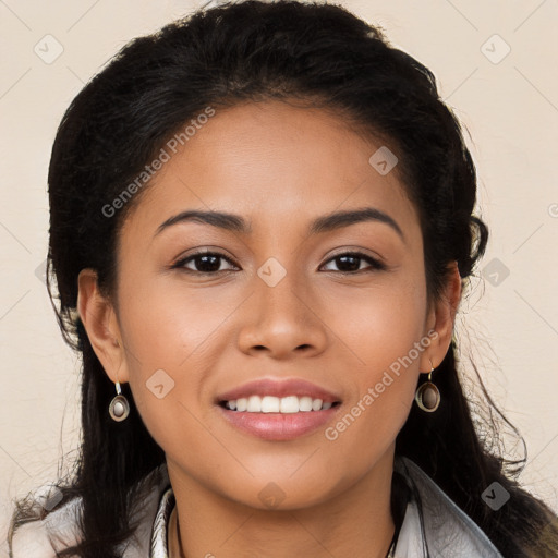 Joyful latino young-adult female with long  brown hair and brown eyes