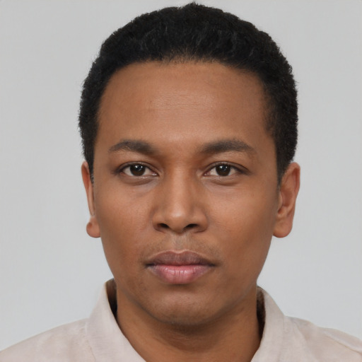Neutral latino young-adult male with short  black hair and brown eyes