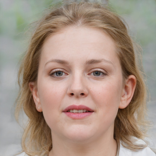 Joyful white young-adult female with medium  brown hair and blue eyes