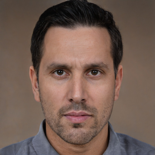 Neutral white adult male with short  black hair and brown eyes