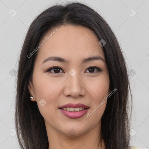 Joyful asian young-adult female with long  brown hair and brown eyes