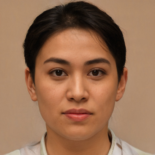 Joyful asian young-adult female with short  brown hair and brown eyes
