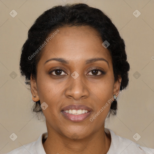 Joyful black adult female with short  brown hair and brown eyes