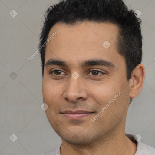 Joyful latino young-adult male with short  black hair and brown eyes