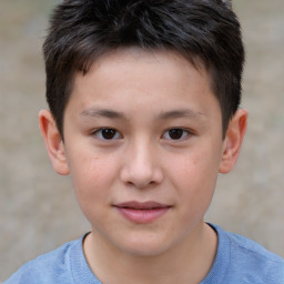 Joyful white child male with short  brown hair and brown eyes