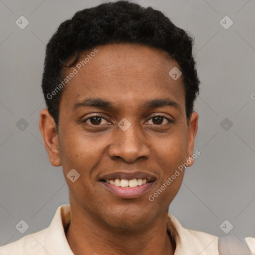 Joyful black young-adult male with short  black hair and brown eyes