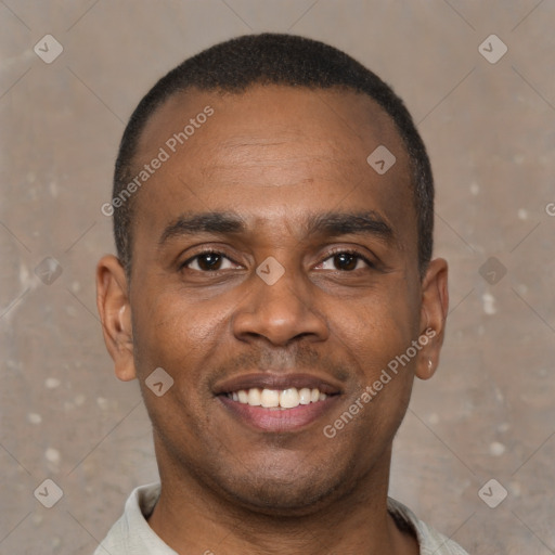 Joyful latino young-adult male with short  brown hair and brown eyes