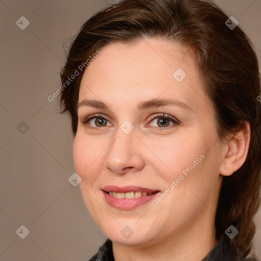 Joyful white adult female with medium  brown hair and brown eyes