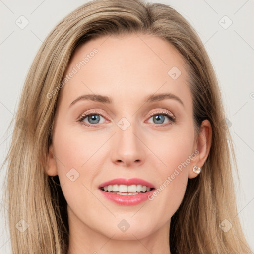 Joyful white young-adult female with long  brown hair and green eyes