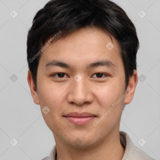 Joyful asian young-adult male with short  brown hair and brown eyes