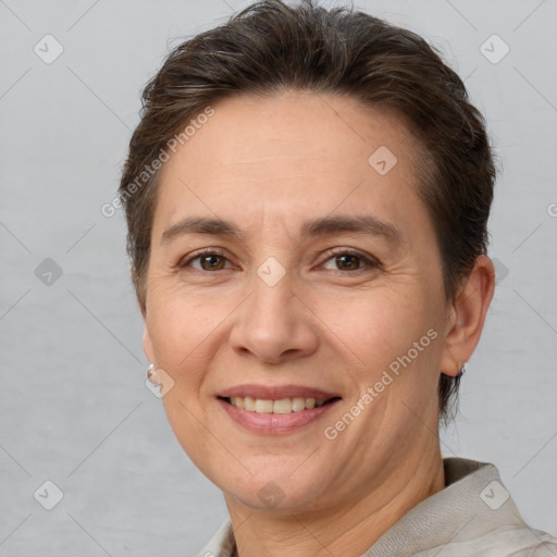 Joyful white adult female with short  brown hair and brown eyes