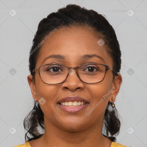 Joyful black adult female with medium  brown hair and brown eyes