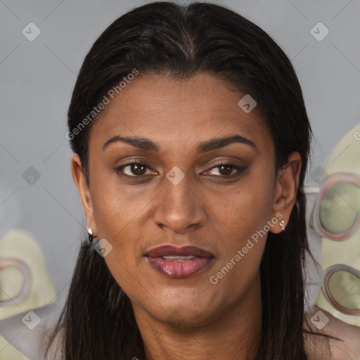 Joyful black young-adult female with long  brown hair and brown eyes