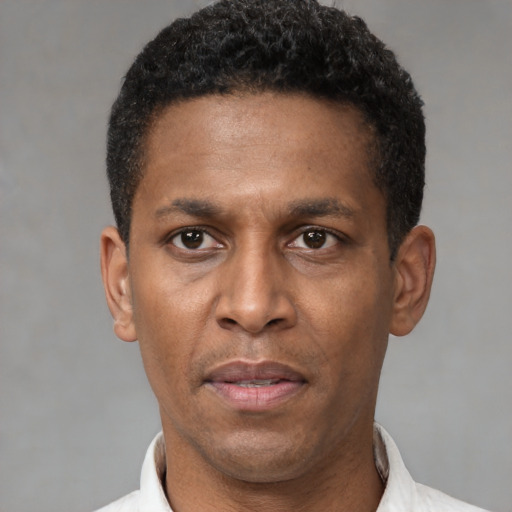 Neutral latino adult male with short  black hair and brown eyes