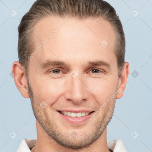 Joyful white adult male with short  brown hair and brown eyes