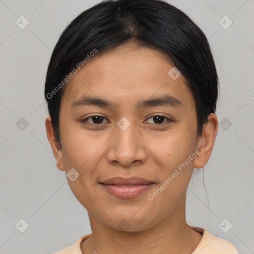 Joyful asian young-adult female with short  black hair and brown eyes