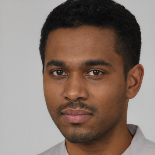 Neutral black young-adult male with short  black hair and brown eyes