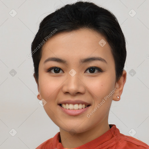 Joyful asian young-adult female with short  black hair and brown eyes