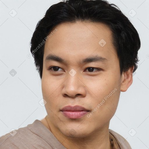 Joyful asian young-adult male with short  black hair and brown eyes