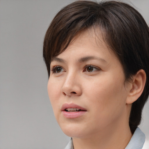Neutral white young-adult female with medium  brown hair and brown eyes