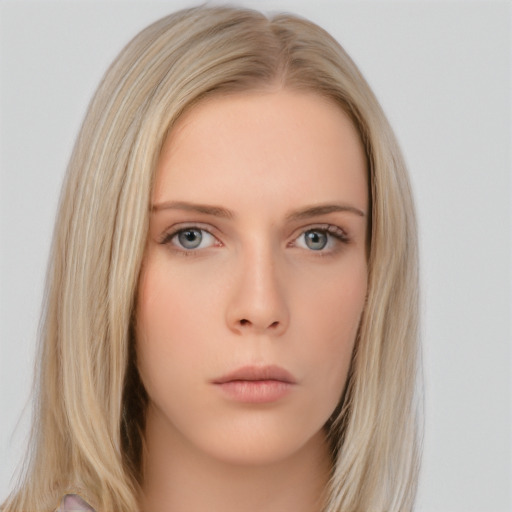 Neutral white young-adult female with long  brown hair and brown eyes