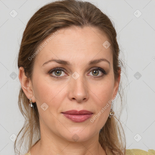 Joyful white adult female with medium  brown hair and grey eyes