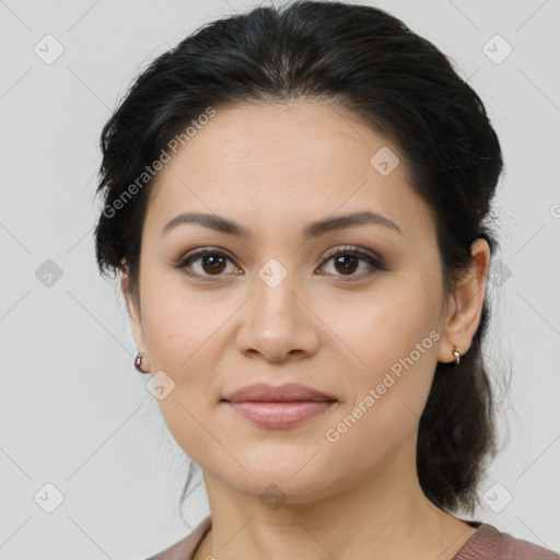 Joyful latino young-adult female with medium  brown hair and brown eyes