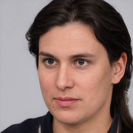 Joyful white young-adult male with medium  brown hair and brown eyes