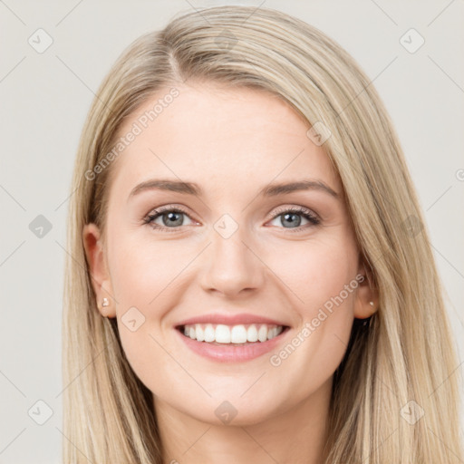 Joyful white young-adult female with long  brown hair and blue eyes