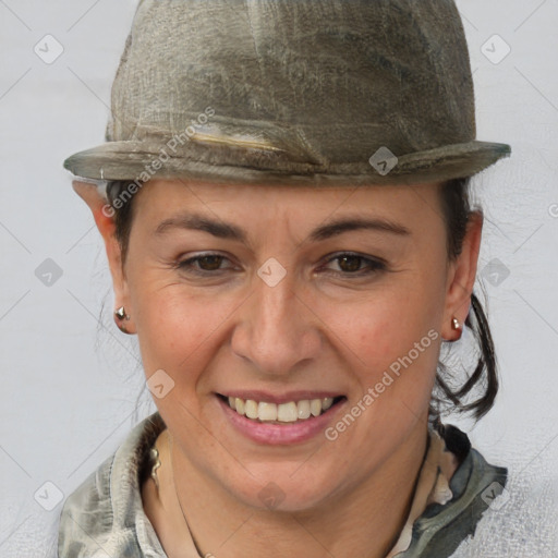 Joyful white adult female with short  brown hair and brown eyes