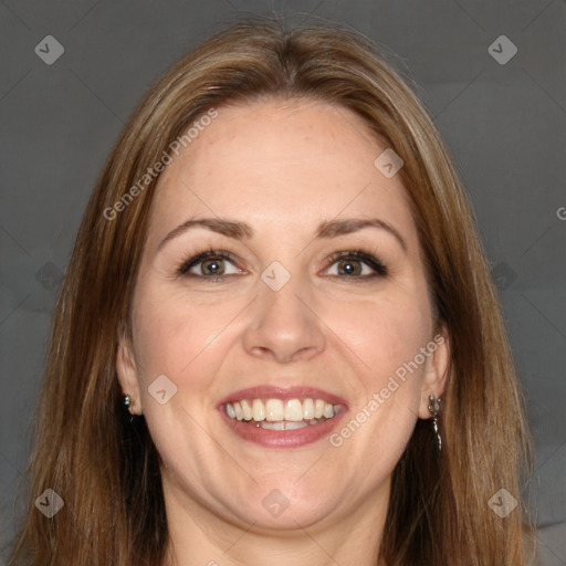 Joyful white adult female with long  brown hair and brown eyes