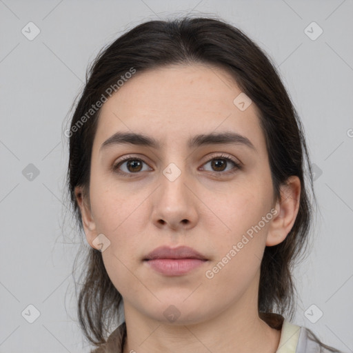 Neutral white young-adult female with medium  brown hair and brown eyes