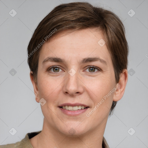 Joyful white young-adult female with short  brown hair and grey eyes