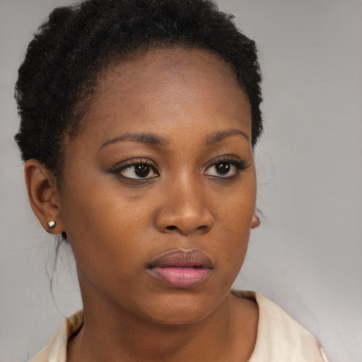 Neutral black young-adult female with short  brown hair and brown eyes