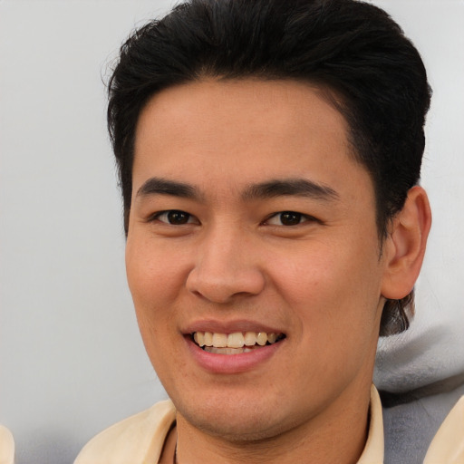 Joyful asian young-adult male with short  brown hair and brown eyes