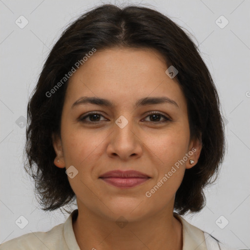 Joyful latino young-adult female with medium  brown hair and brown eyes