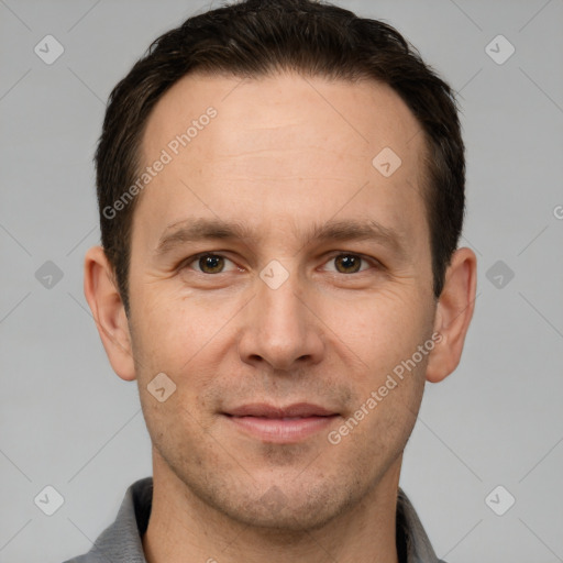 Joyful white adult male with short  brown hair and brown eyes