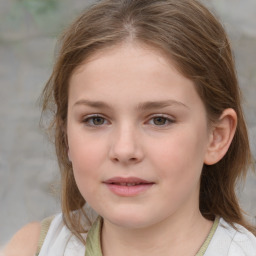 Joyful white child female with medium  brown hair and grey eyes