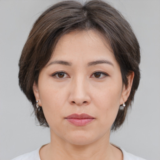 Neutral white young-adult female with medium  brown hair and brown eyes