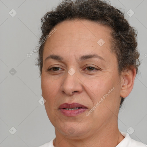 Joyful white adult female with short  brown hair and brown eyes