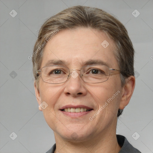 Joyful white adult male with short  brown hair and grey eyes