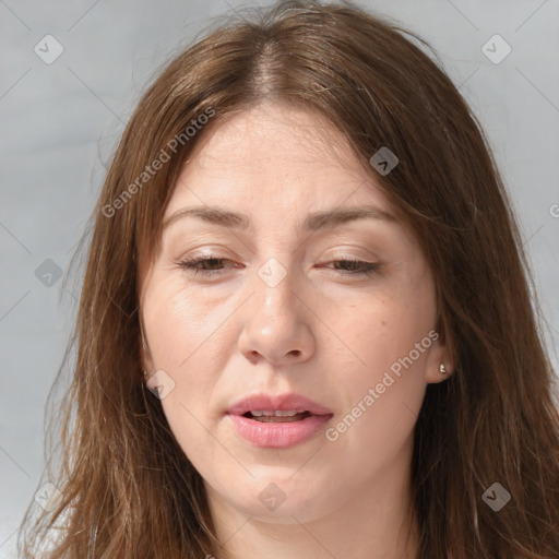 Joyful white adult female with long  brown hair and brown eyes