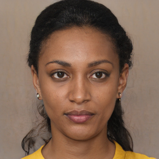 Neutral black young-adult female with short  black hair and brown eyes