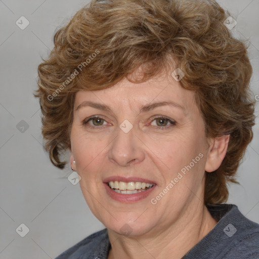 Joyful white adult female with medium  brown hair and blue eyes