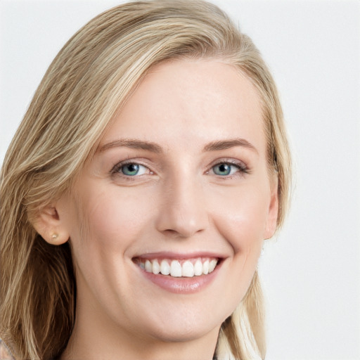 Joyful white young-adult female with long  brown hair and blue eyes