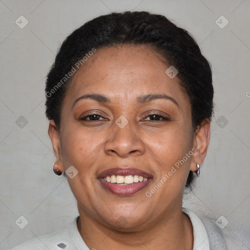 Joyful black adult female with short  brown hair and brown eyes