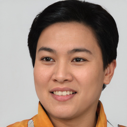 Joyful asian young-adult female with short  black hair and brown eyes