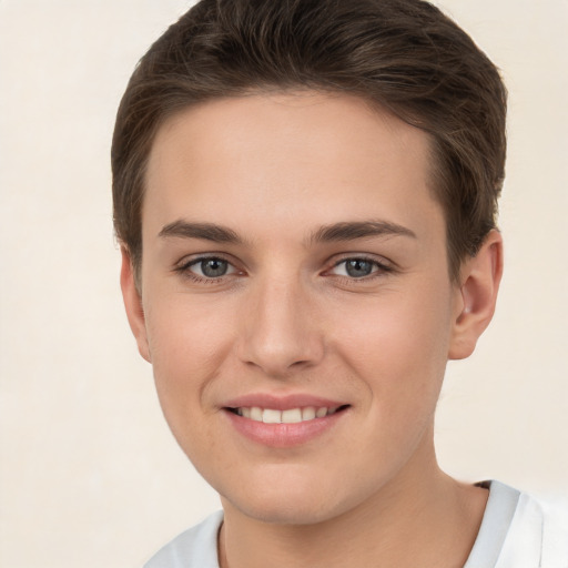 Joyful white young-adult female with short  brown hair and brown eyes