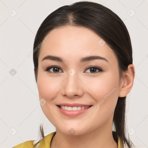 Joyful white young-adult female with long  brown hair and brown eyes